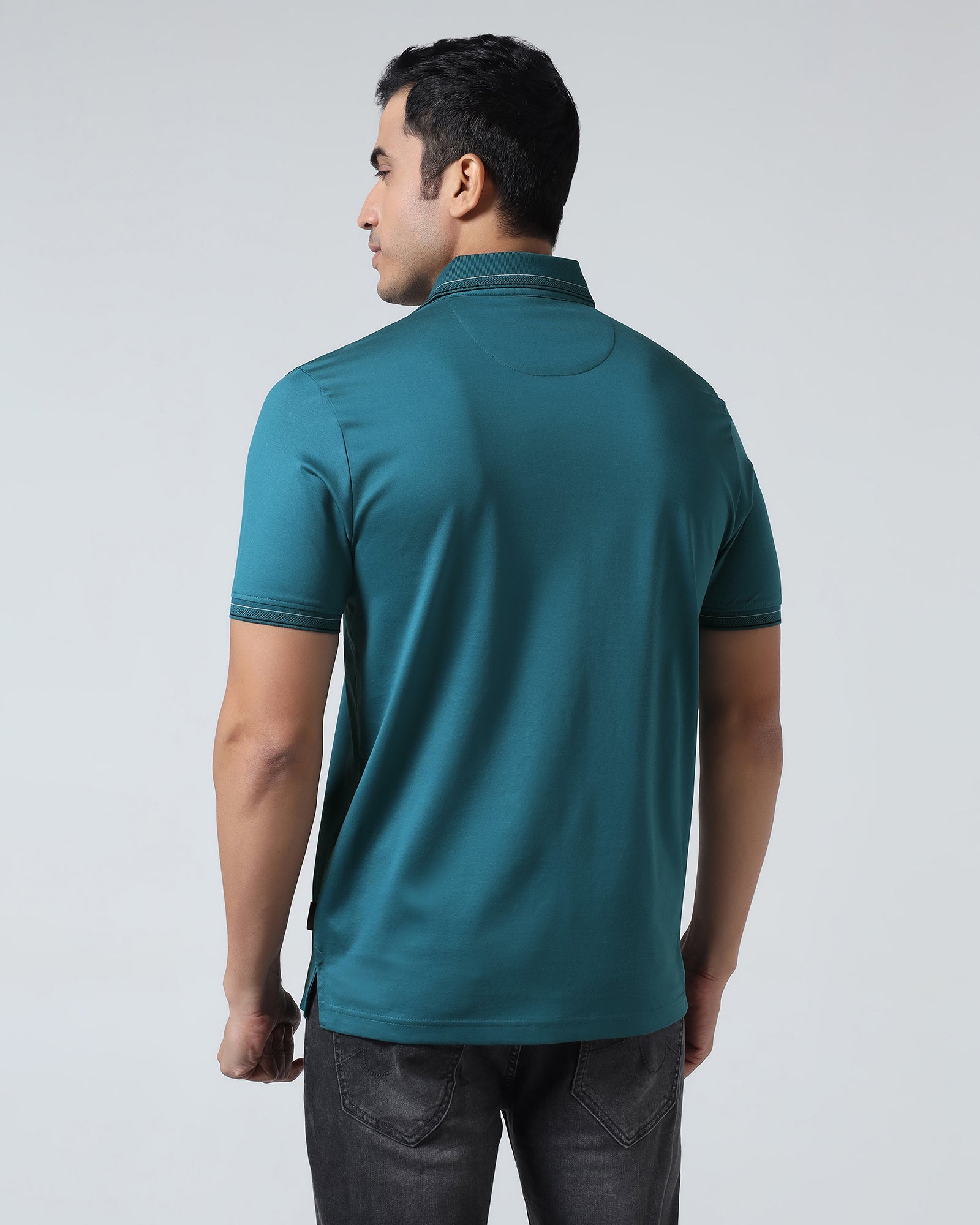 Buy Deep Teal Solid Polo From Ram Collection