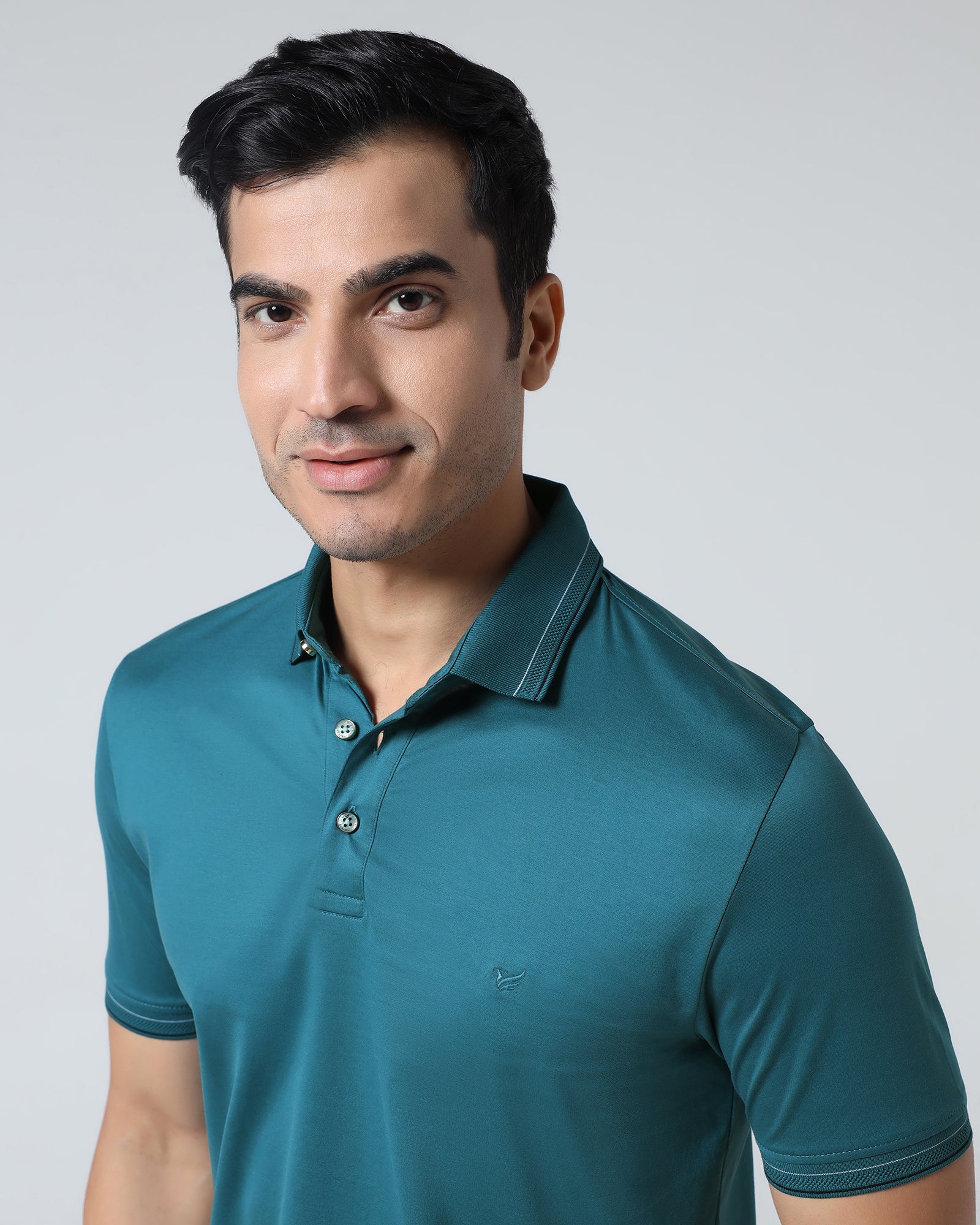 Buy Deep Teal Solid Polo From Ram Collection